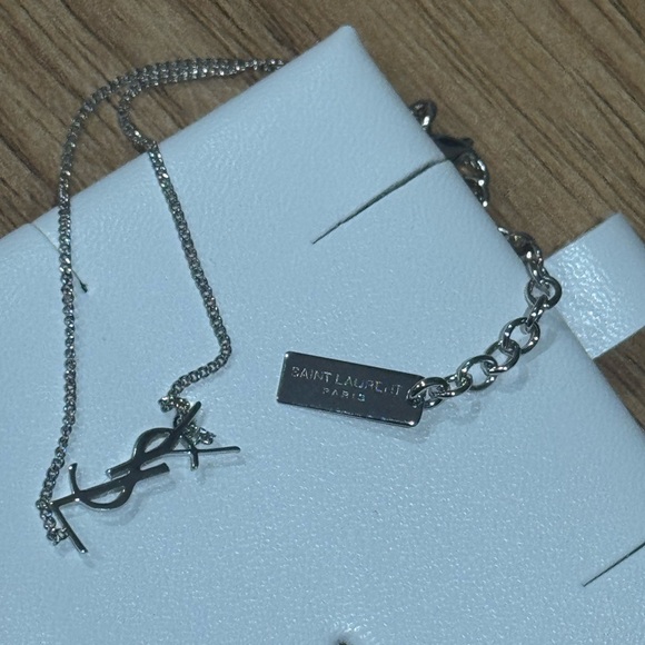 Yves Saint Laurent Jewelry - Silver Cassandre charm YSL bracelet